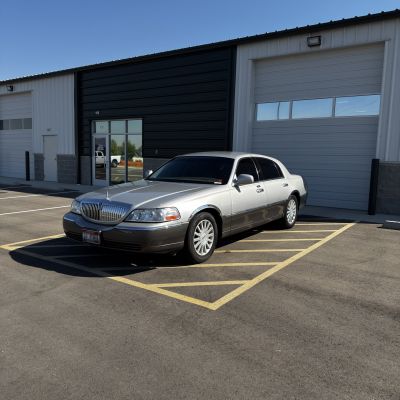 2003 Lincoln Town Car with carbon tint, after photo 1